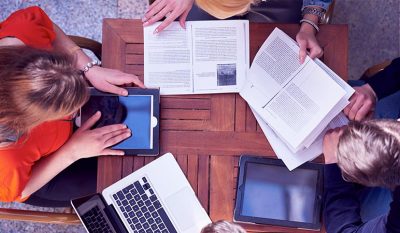 Overhead image of people learning as a group.