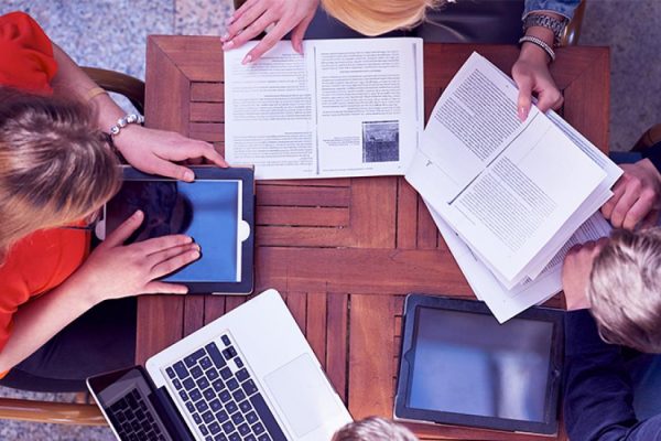 Overhead image of people learning as a group.