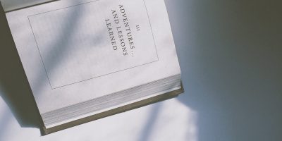 Overhead image of an open book on a white background.