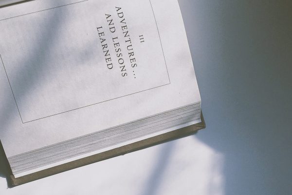 Overhead image of an open book on a white background.